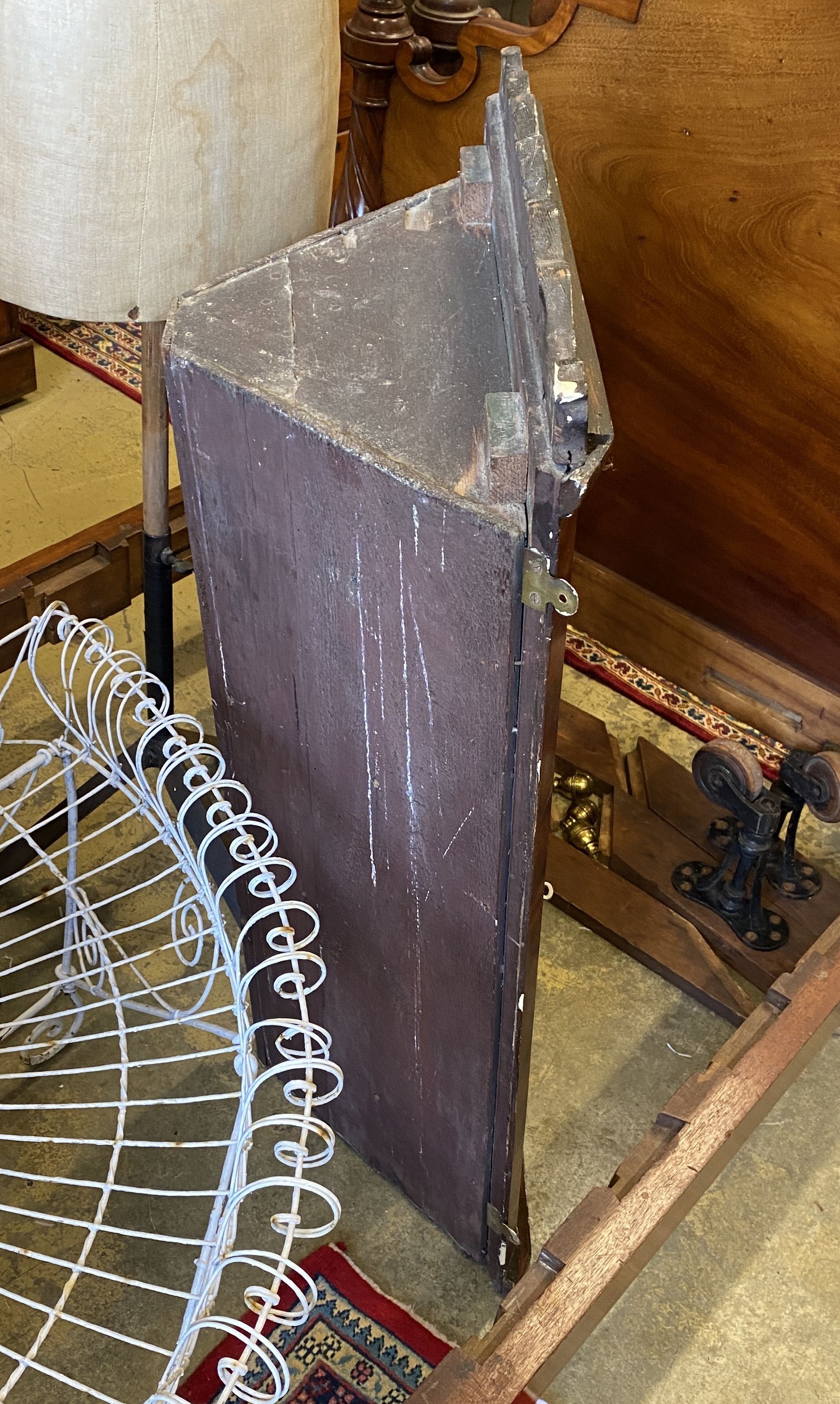 A George III walnut hanging corner cabinet, width 60cm, depth 28cm, height 102cm
